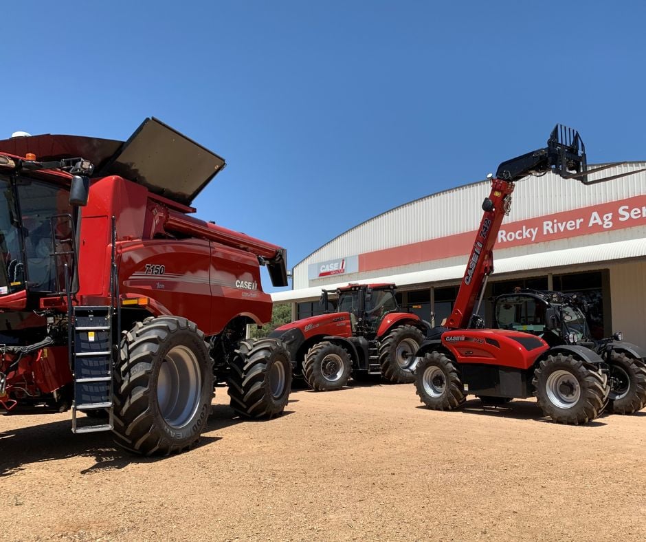 3 red Case IH machinery