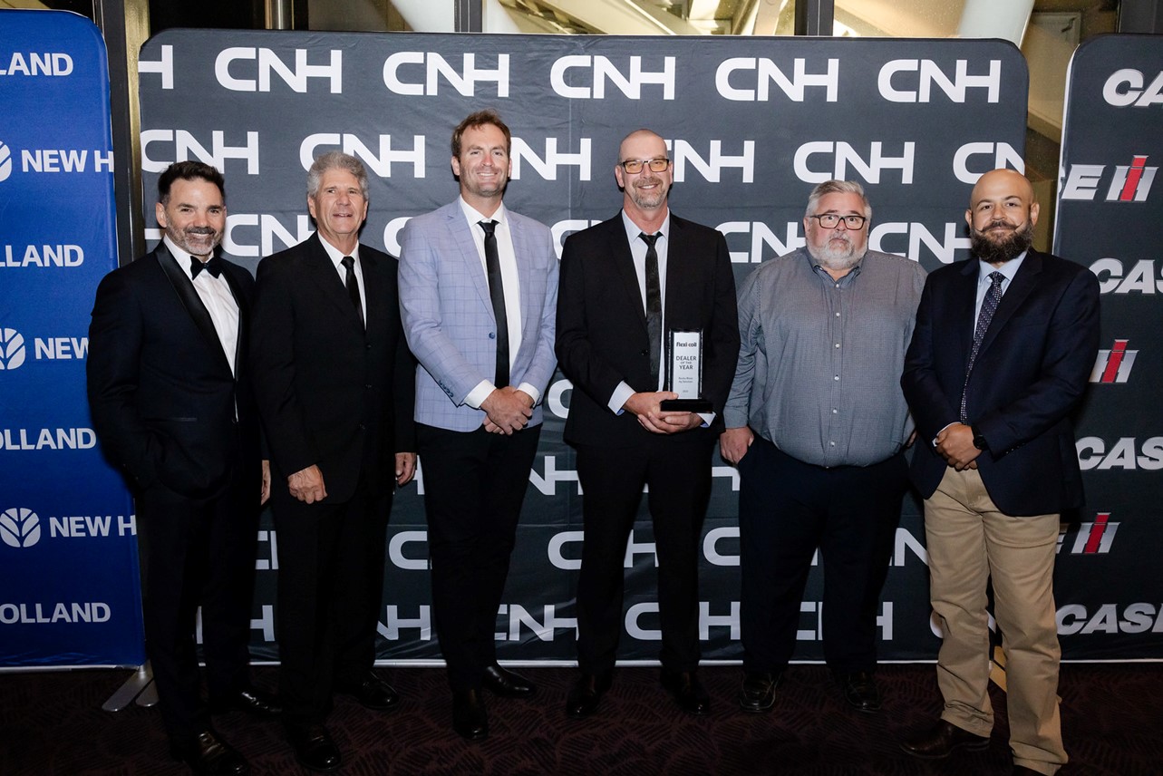 Six team members accepting an award